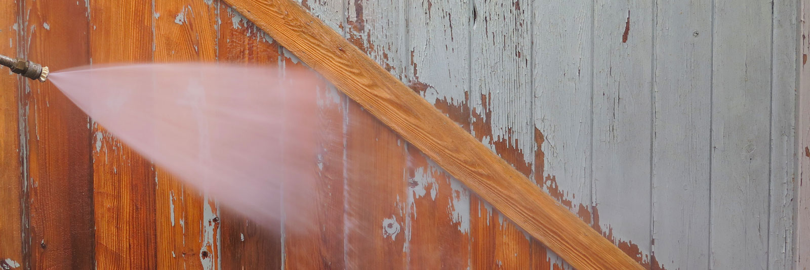 paint being stripped by high pressure washing